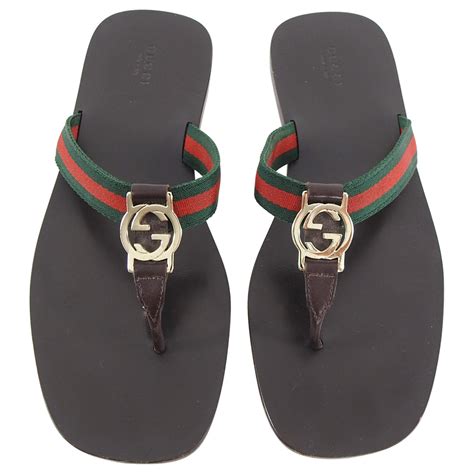 gucci brown gg guccissima embossed logo flats flip sandals|Gucci rubber sandals.